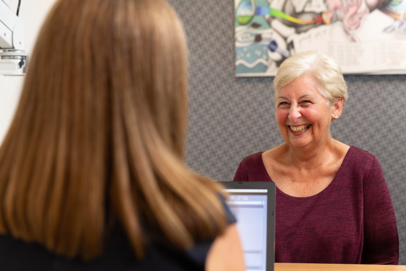 adult woman getting hearing check adult woman getting hearing check