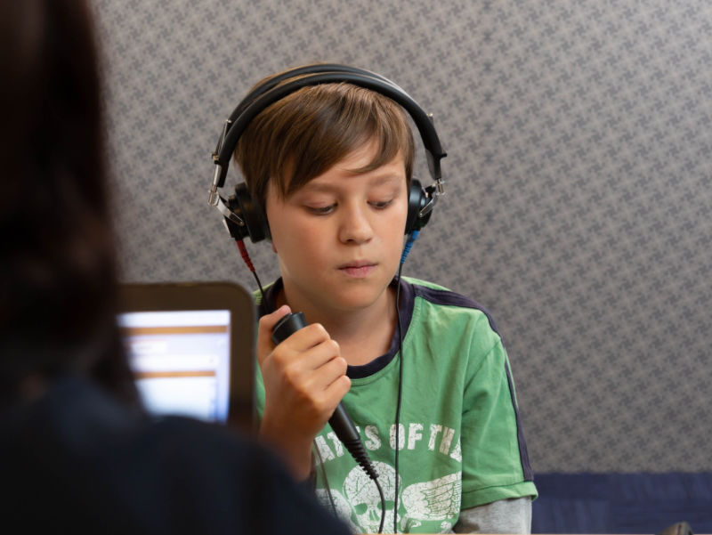 boy doing hearing test at audiologist boy doing hearing test at audiologist
