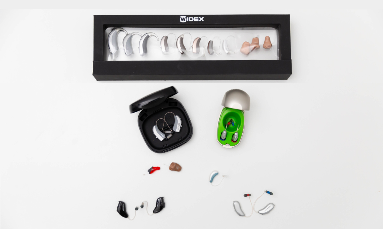 hearing aids laid out on table hearing aids laid out on table