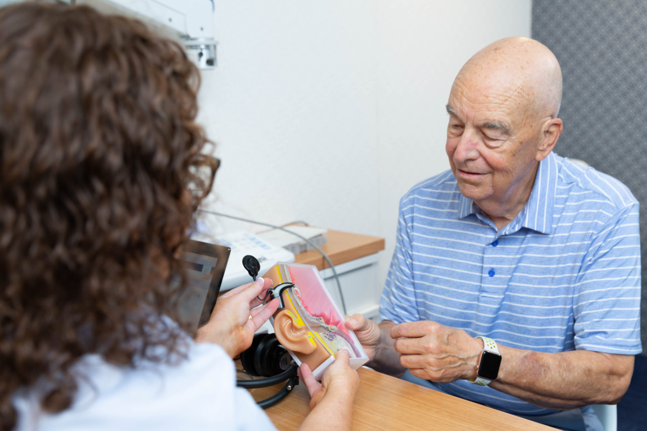 pensioner with audiologist hearing services
