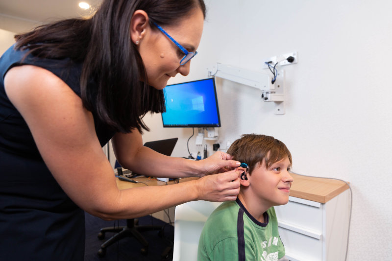 child with hearing aid fitted child with hearing aid fitted