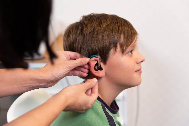 child with hearing aid getting fitted child with hearing aid getting fitted