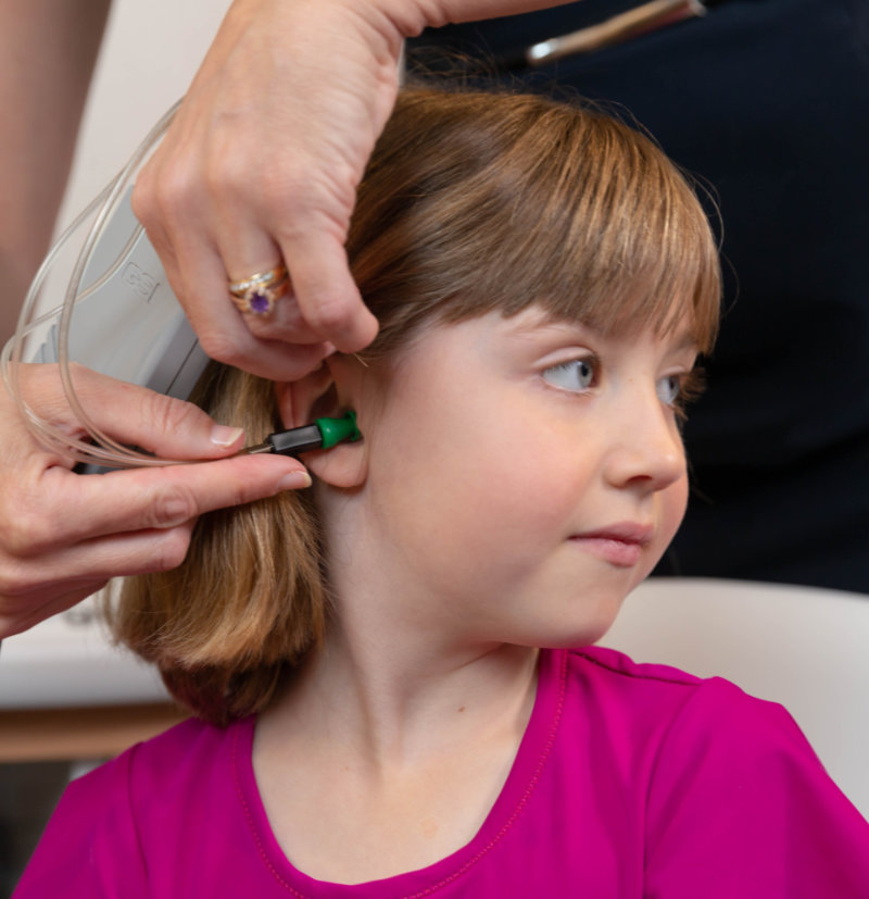 child with hearing loss during hearing test