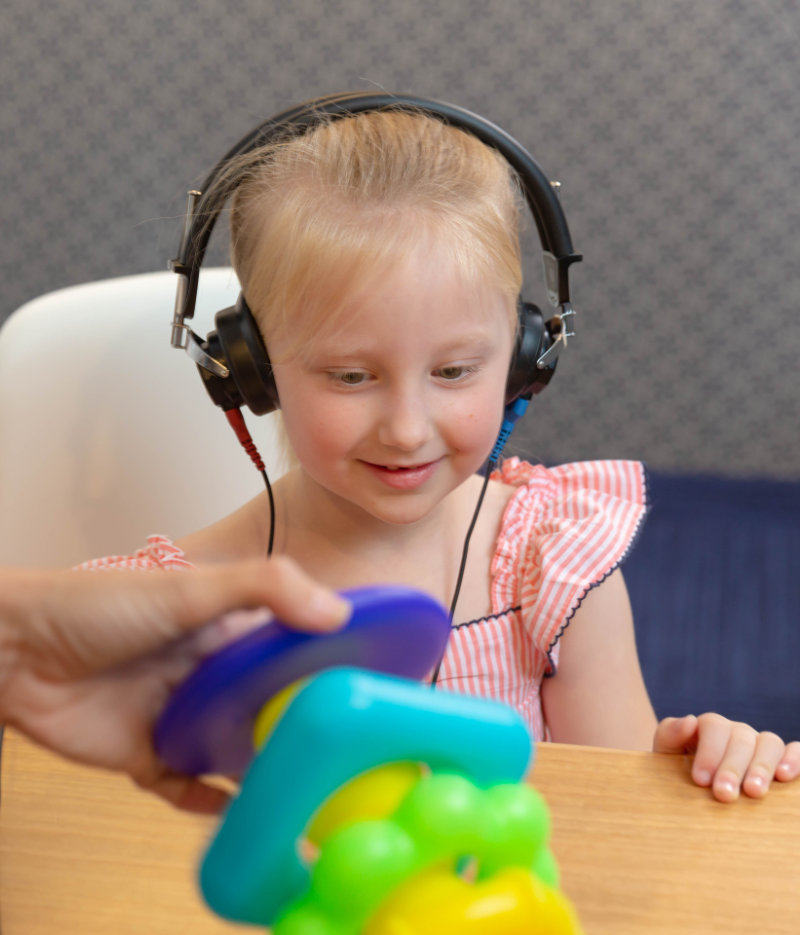 child with hearing loss has hearing test