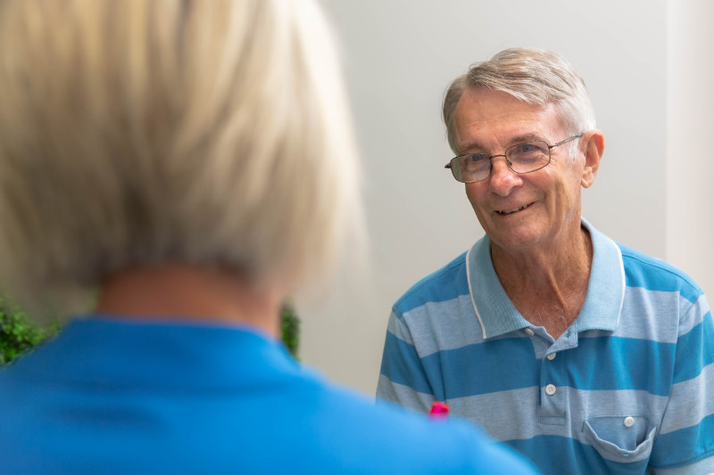 man talking to audiologist about hearing protection man talking to audiologist about hearing protection